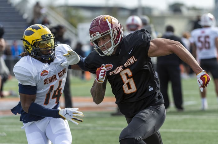 Jan 22, 2020; Mobile, Alabama, USA; North safety Josh Metellus of Michigan (14) and North wide receiver Michael Pittman Jr. of USC (6) spar in passing drills during Senior Bowl practice at Ladd-Peebles Stadium.